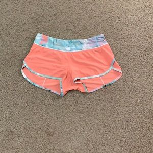 Lululemon coral colored shorts size 6 in women’s, zipper pocket in the back.